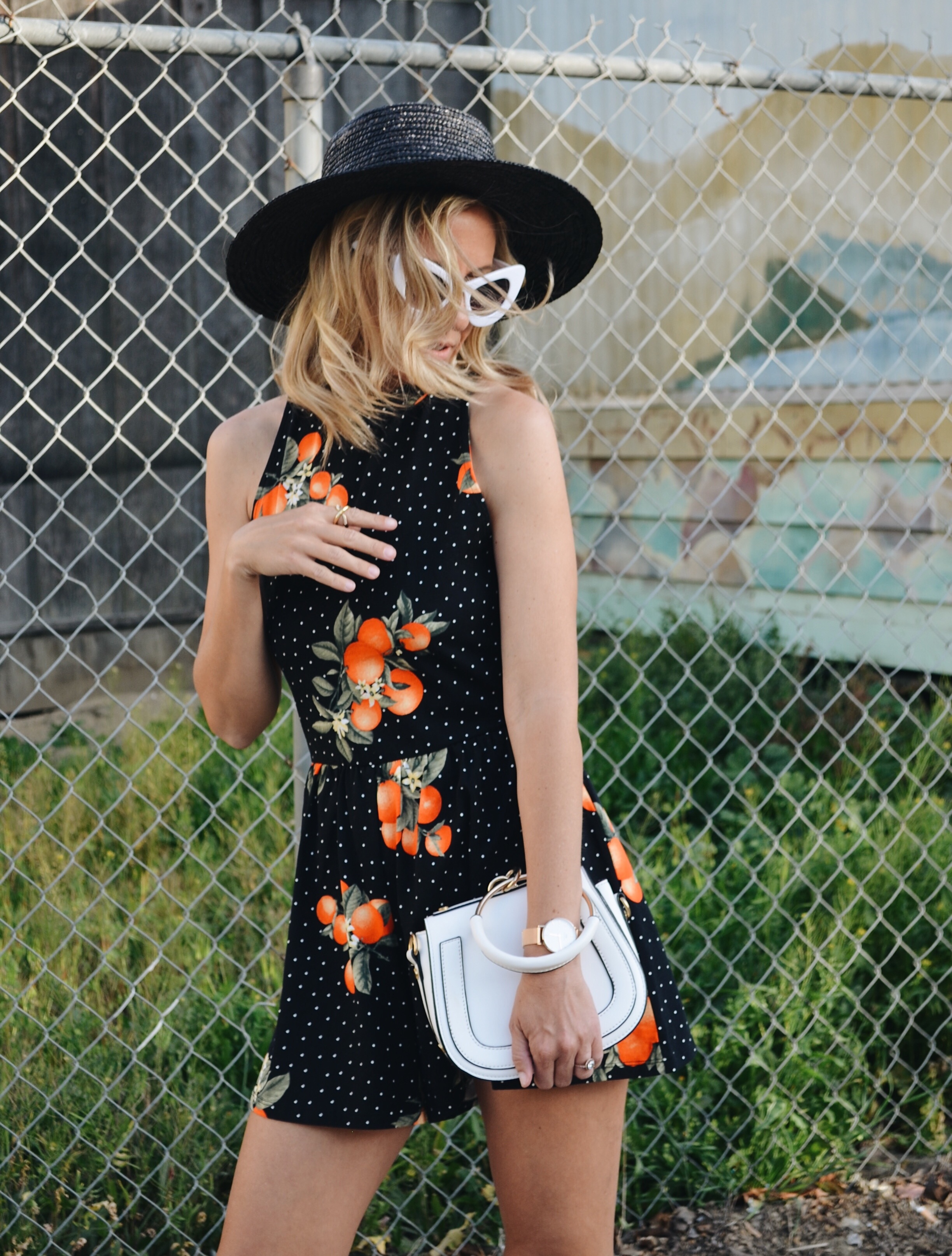 ORANGE ROMPER - Jaclyn De Leon Style - summer style + fruit inspired look + spring outfit + fun edgy street style + forever 21 + retro sunglasses + chloe dupe handbag + statement earrings