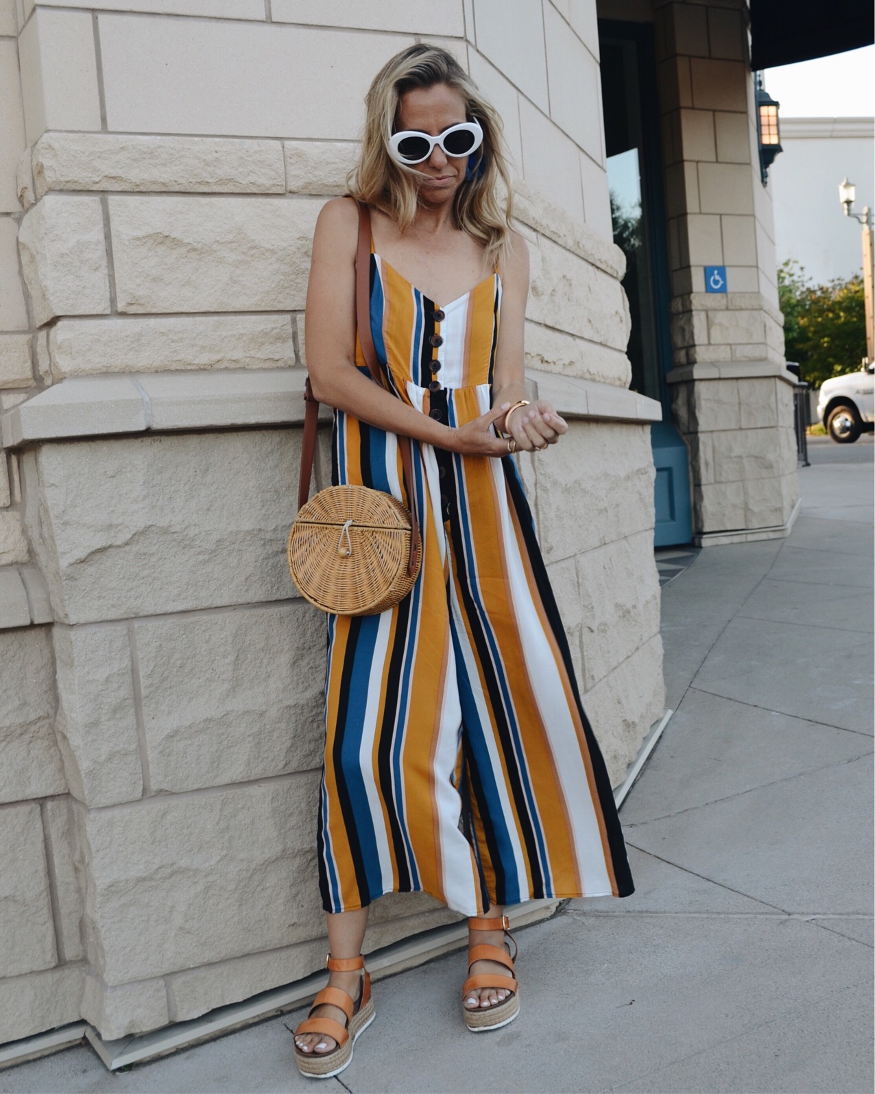 THE MUST HAVE SHOE TREND-PLATFORMS- Jaclyn De Leon Style - striped jumpsuit + woven handbag + espadrille sandals + retro style sunglasses + what to wear this summer + casual street style + DSW