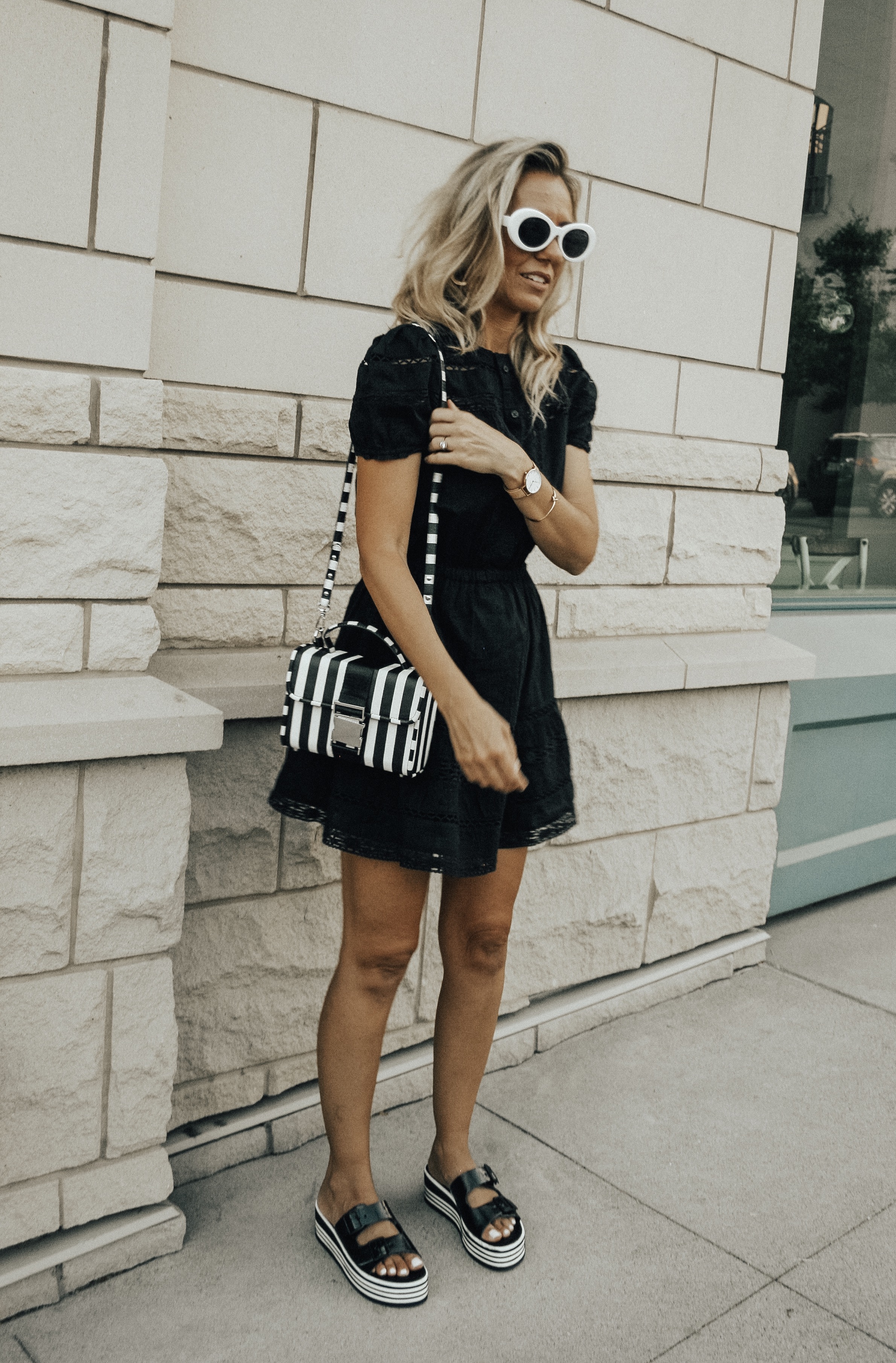 BLACK, WHITE + A LITTLE BIT RETRO- Jaclyn De Leon Style + black lace dress + black and white striped crossbody handbag + platform sandals + retro style sunglasses + urban outfitters + Zara handbag + boho chic street style + summer outfit + style inspiration