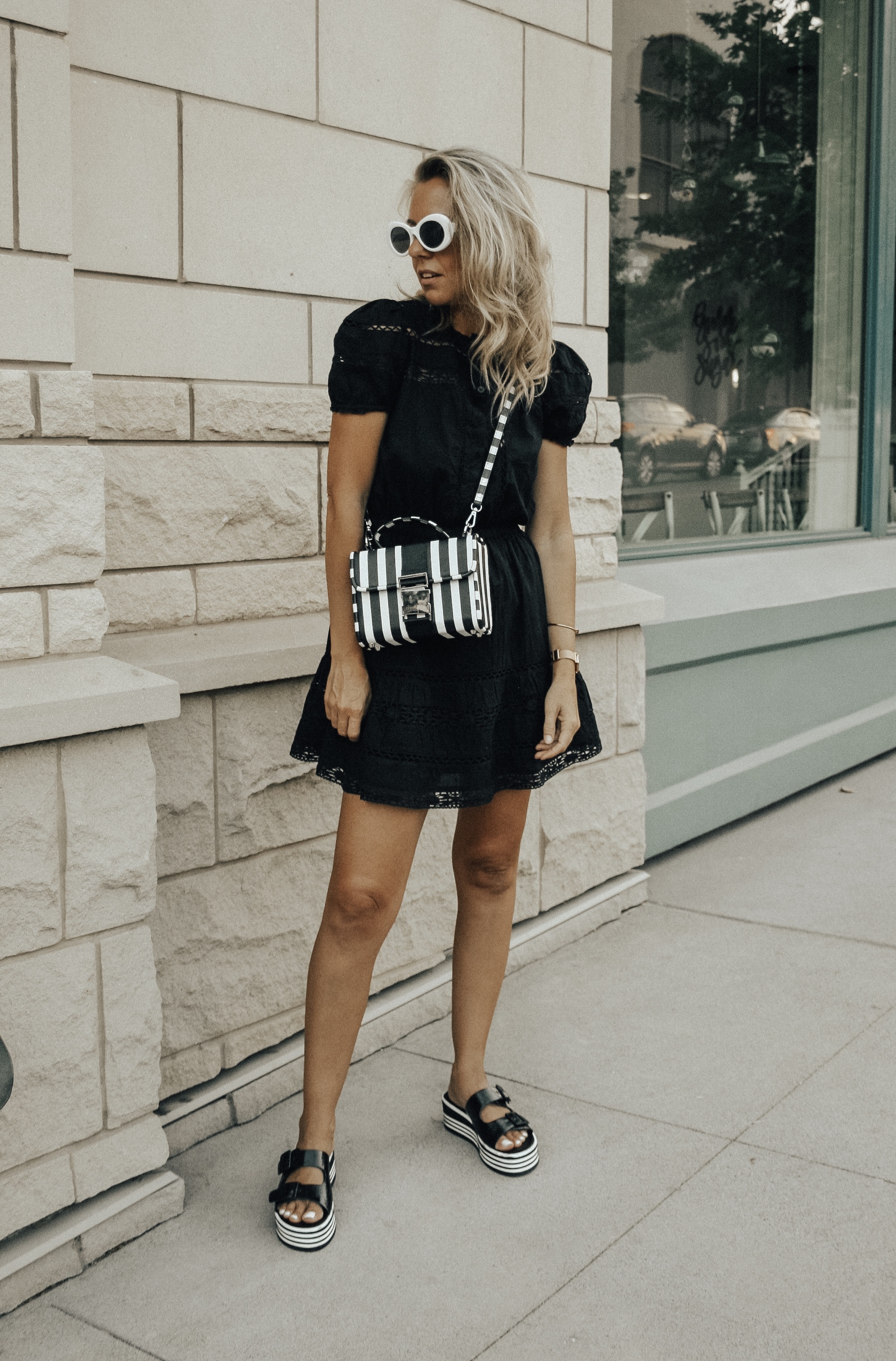 BLACK, WHITE + A LITTLE BIT RETRO- Jaclyn De Leon Style + black lace dress + black and white striped crossbody handbag + platform sandals + retro style sunglasses + urban outfitters + Zara handbag + boho chic street style + summer outfit + style inspiration