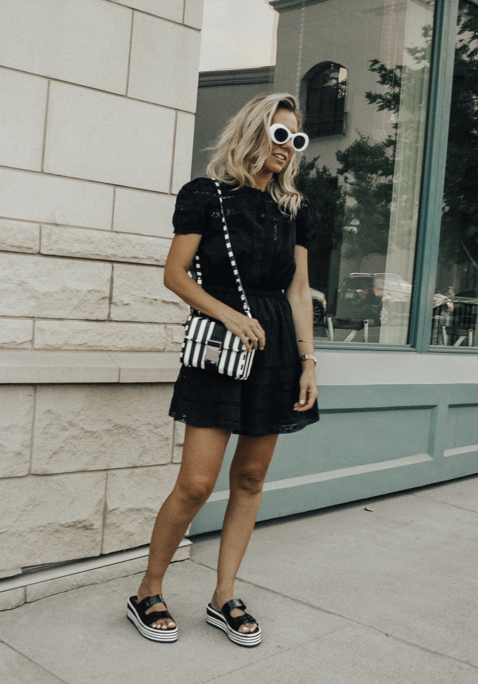 BLACK, WHITE + A LITTLE BIT RETRO- Jaclyn De Leon Style + black lace dress + black and white striped crossbody handbag + platform sandals + retro style sunglasses + urban outfitters + Zara handbag + boho chic street style + summer outfit + style inspiration