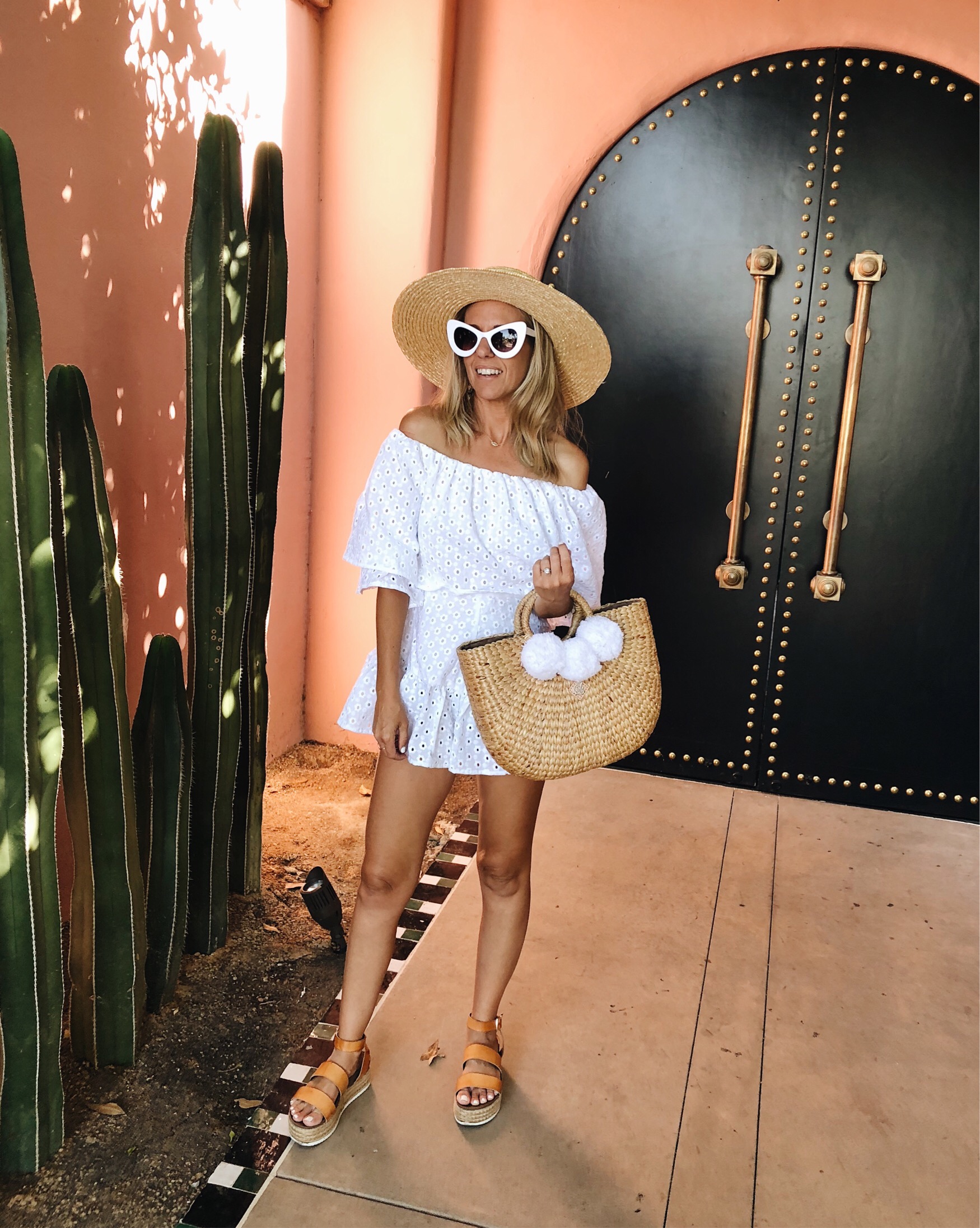 ANNIVERSARY WEEKEND GETAWAY AT THE SANDS HOTEL- Jaclyn De Leon Style + PALM SPRINGS HOTEL + BOHEMIAN + PINK WALL WITH CACTUS + WHITE EYELET ROMPER + RETRO SUNGLASSES + POM POM STRAW BEACH TOTE + WIDE BRIM STRAW HAT + PLATFORM SANDALS + ASOS OUTFIT + SUMMER STYLE + VACATION + TRAVEL