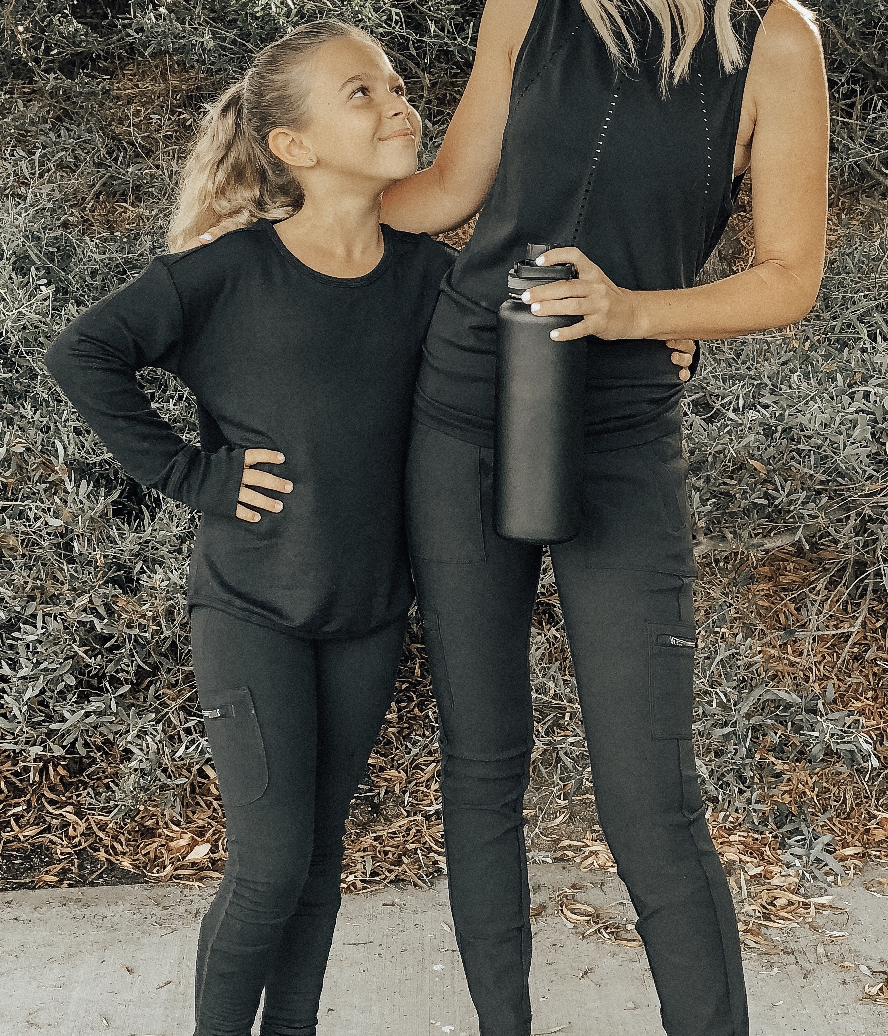 STAYING ACTIVE WITH ATHLETA- Jaclyn De Leon Style + Mommy and me matching looks + active wear + soccer + sports + momlife + stretching + black chic athletic wear