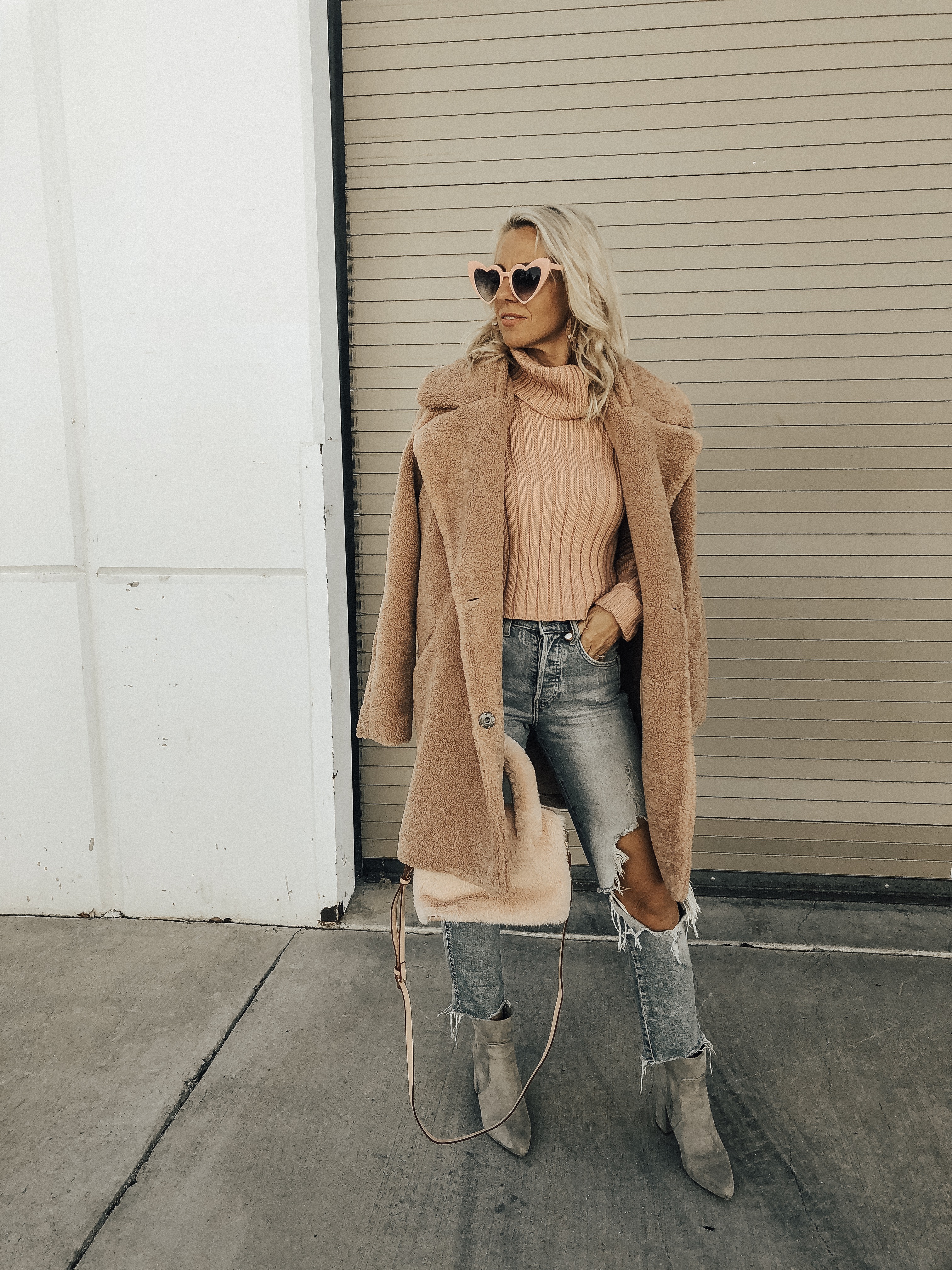 THINK PINK- Jaclyn De Leon Style + pink for October + cozy tutleneck sweater + teddy coat + distressed denim + pink faux fur handbag + heart sunglasses + casual style + fall fashion + street style + mom style + what to wear this season + winter outfit