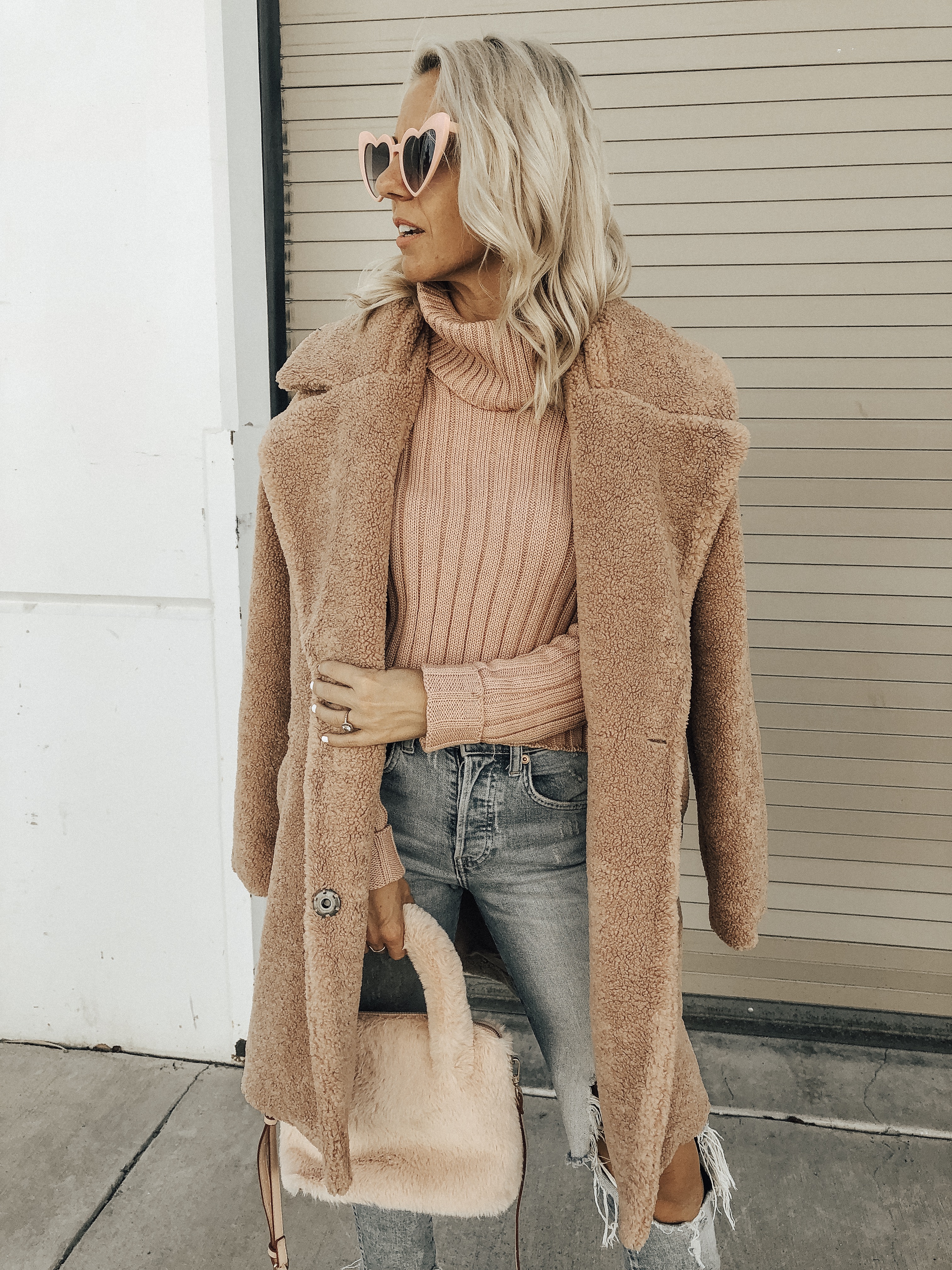 OCTOBER TOP 10- Jaclyn De Leon Style + pink for October + cozy tutleneck sweater + teddy coat + distressed denim + pink faux fur handbag + heart sunglasses + casual style + fall fashion + street style + mom style + what to wear this season + winter outfit