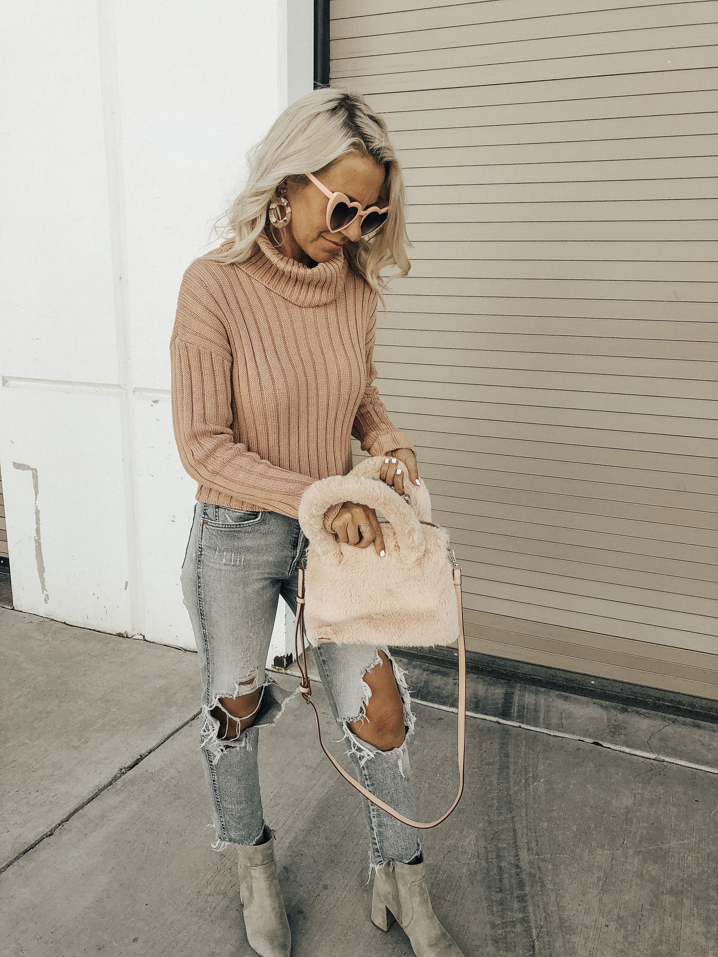 THINK PINK- Jaclyn De Leon Style + pink for October + cozy tutleneck sweater + teddy coat + distressed denim + pink faux fur handbag + heart sunglasses + casual style + fall fashion + street style + mom style + what to wear this season + winter outfit