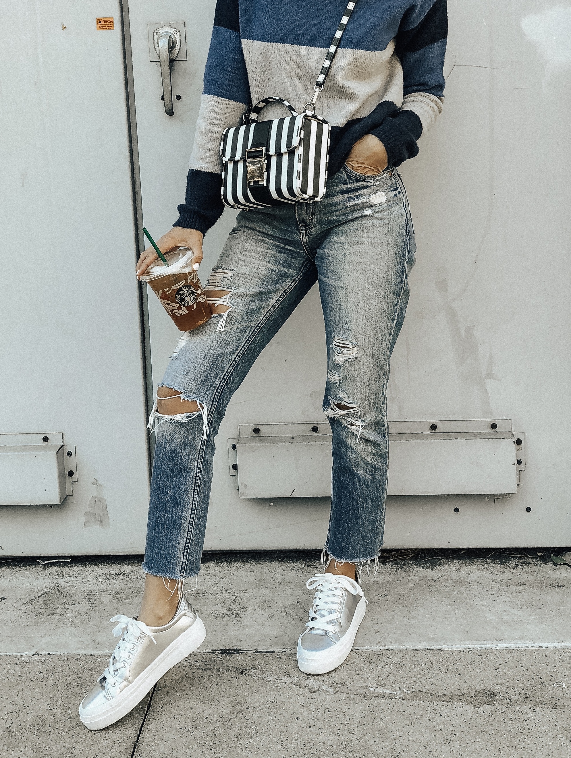 NOVEMBER TOP 10- Jaclyn De Leon Style + high rise mom jeans + abercrombie denim + distressed high rise jeans + casual street style + platform sneakers + mom style + starbucks + striped sweater + what to buy this season + top selling items