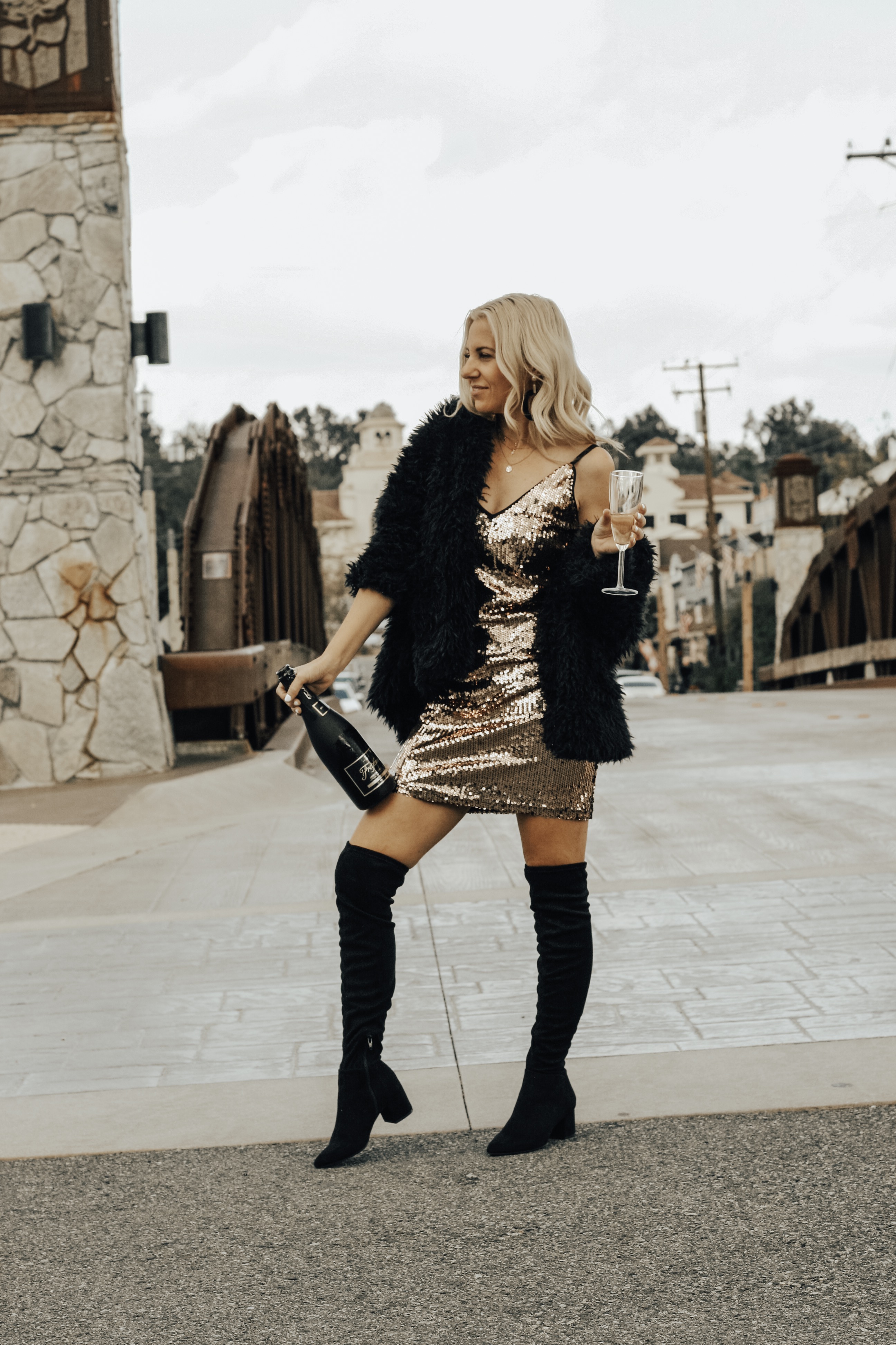 NYE PARTY LOOKS- Jaclyn De Leon Style + New Years Eve party dress + champagne + celebrate + street style + party outfit + sequin dress + cocktail dress + winter style + OTK boots + target style + affordable fashion + mom style + cozy faux fur jacket + mini dress