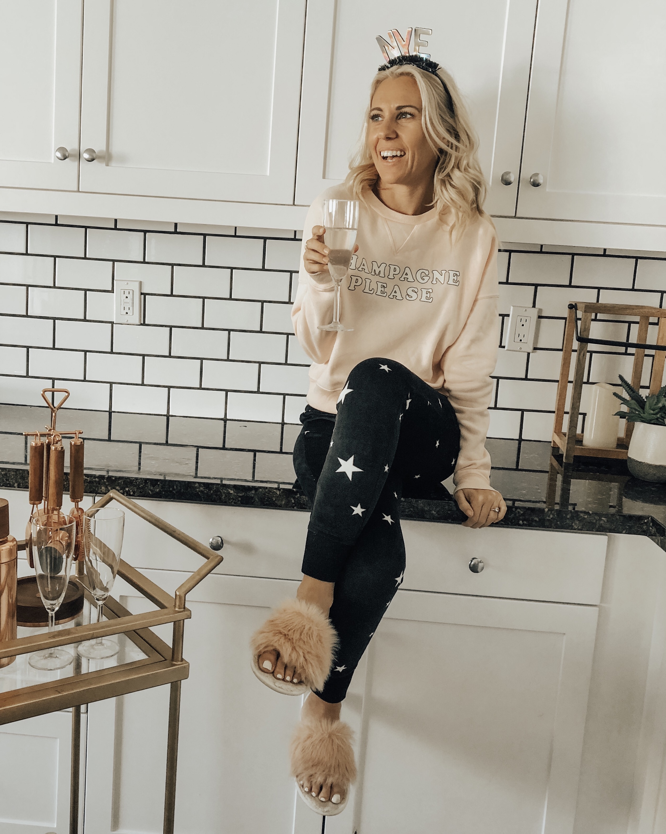 A COZY & CASUAL NYE- Jaclyn De Leon Style + New Years 2019 + casual sweatshirt + star print jogger pants + champagne please + target style + bar cart + party supplies + cozy home + party planning + lounging at home + countdown to New Years