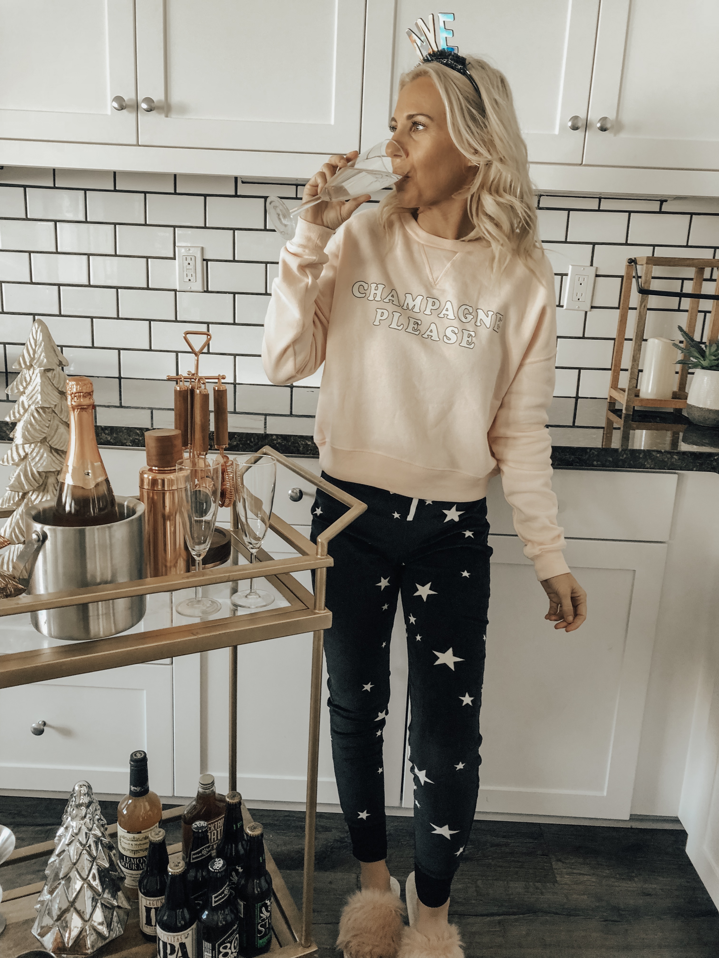 A COZY & CASUAL NYE- Jaclyn De Leon Style + New Years 2019 + casual sweatshirt + star print jogger pants + champagne please + target style + bar cart + party supplies + cozy home + party planning + lounging at home + countdown to New Years