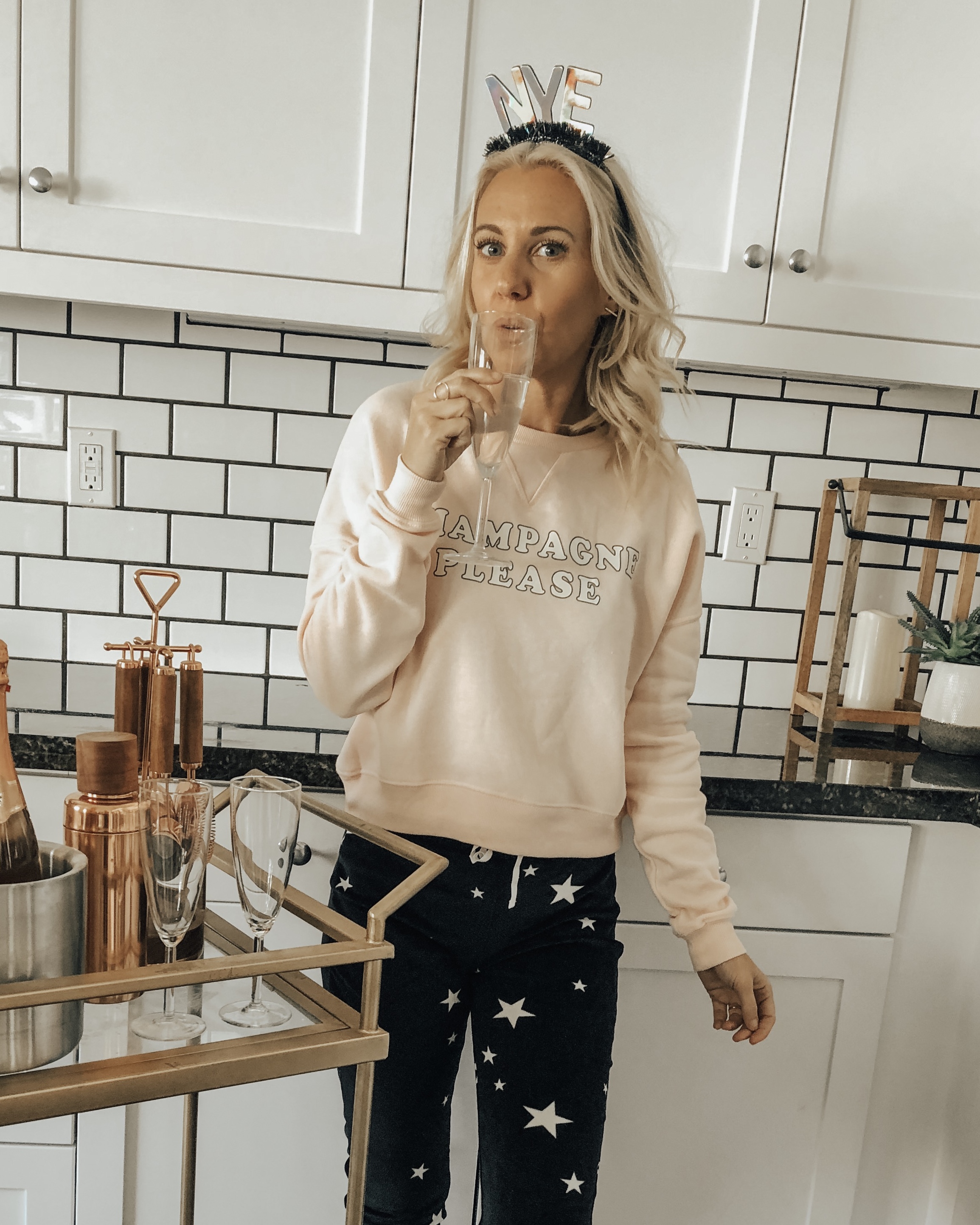 A COZY & CASUAL NYE- Jaclyn De Leon Style + New Years 2019 + casual sweatshirt + star print jogger pants + champagne please + target style + bar cart + party supplies + cozy home + party planning + lounging at home + countdown to New Years