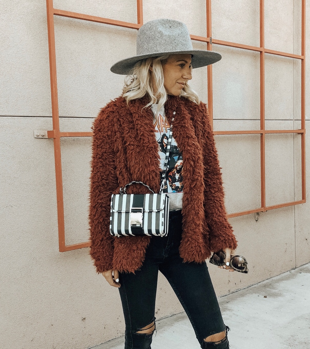 DECEMBER TOP 10- Jaclyn De Leon Style + cozy faux fur jacket + striped handbag + winter style + band tee + belk + nordstrom style + casual street style + cozy winter layers