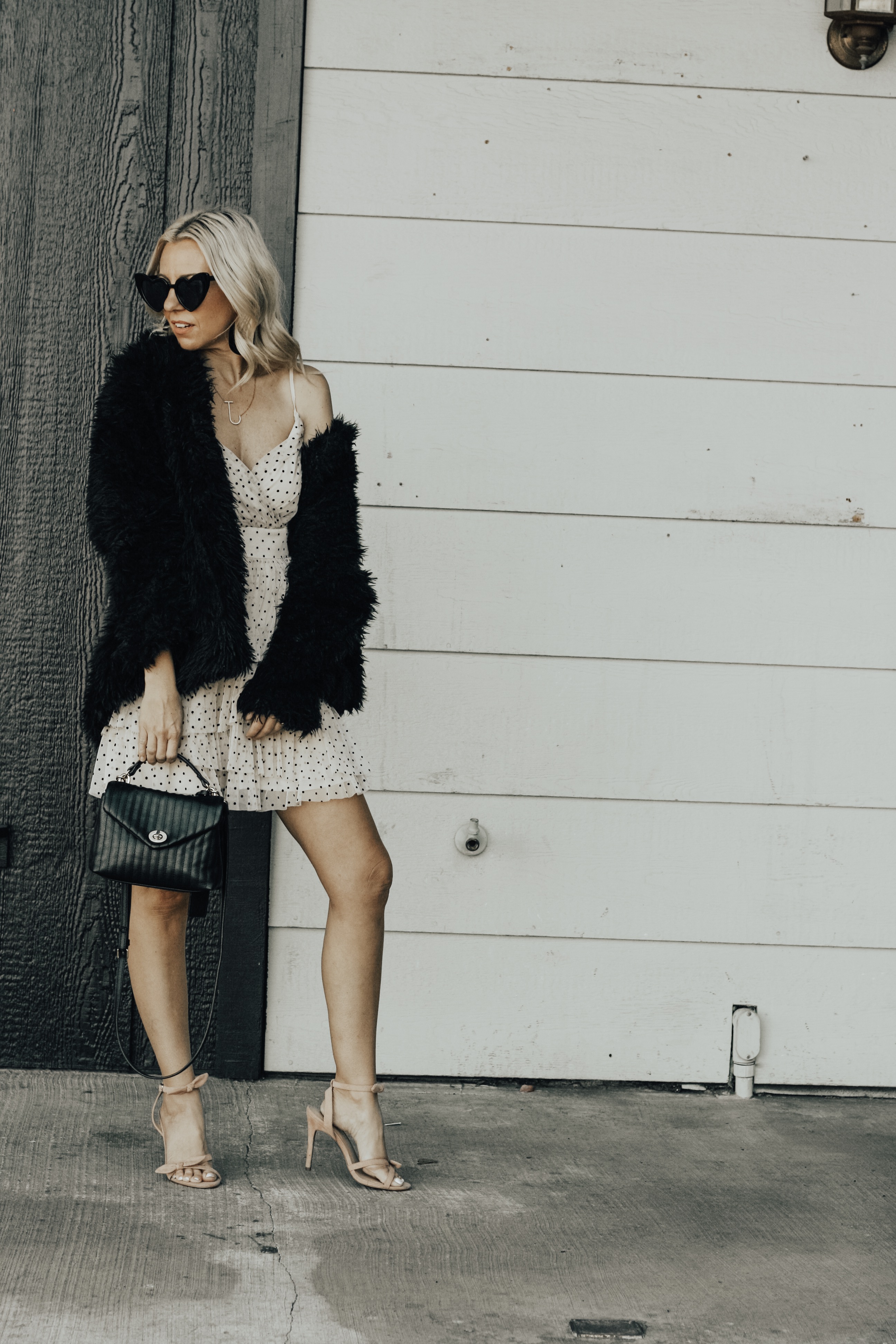 TWO VALENTINE'S DATE NIGHT LOOKS- Jaclyn De Leon Style + heard midi dress + black and white outfit + Valentine outfit inspo + asos + black booties + heart sunglasses + striped handbag + ruffle dot baby doll dress + abercrombie + faux fur jacket + stilettos + girls night out + dress up + spring street style