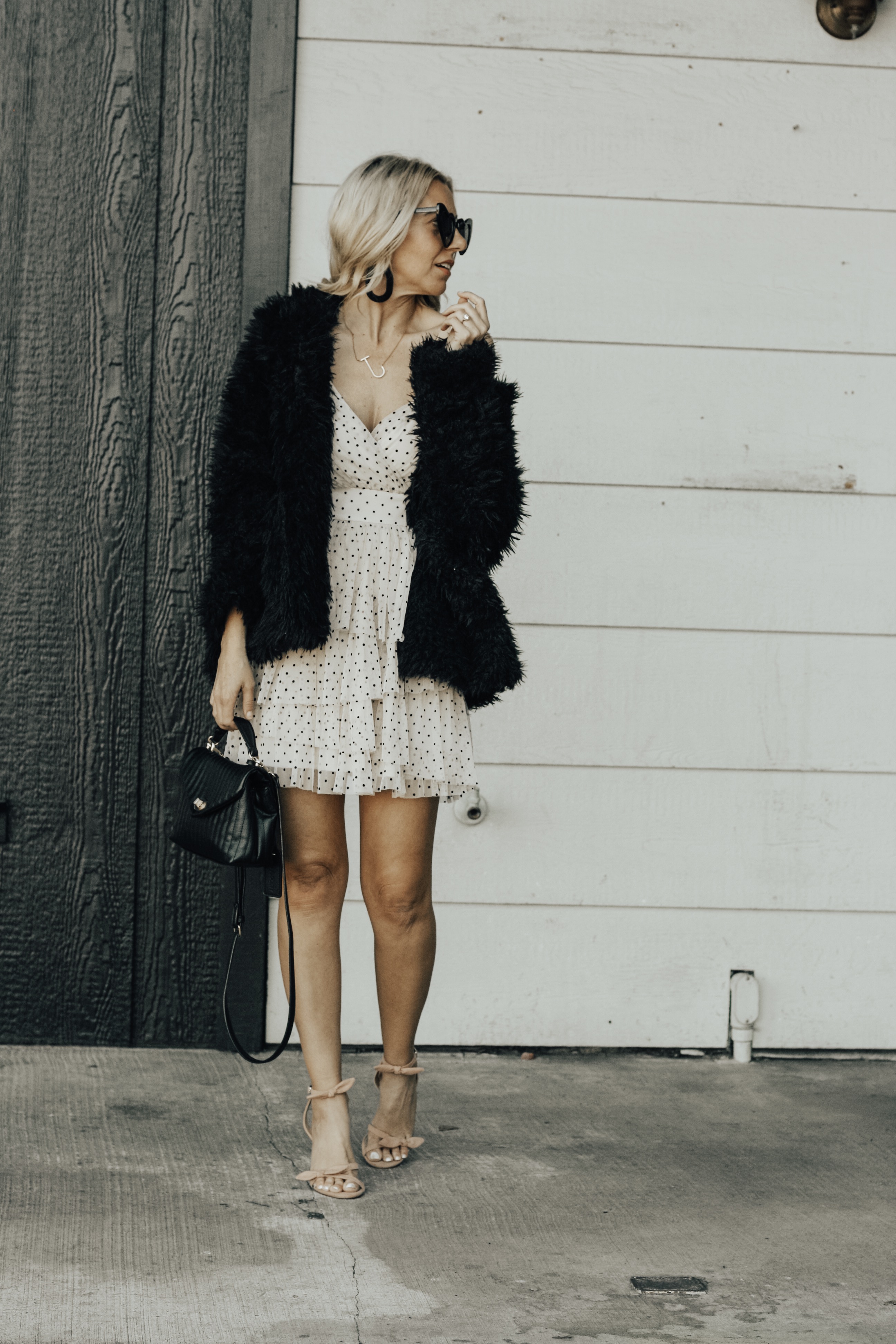 TWO VALENTINE'S DATE NIGHT LOOKS- Jaclyn De Leon Style + heard midi dress + black and white outfit + Valentine outfit inspo + asos + black booties + heart sunglasses + striped handbag + ruffle dot baby doll dress + abercrombie + faux fur jacket + stilettos + girls night out + dress up + spring street style
