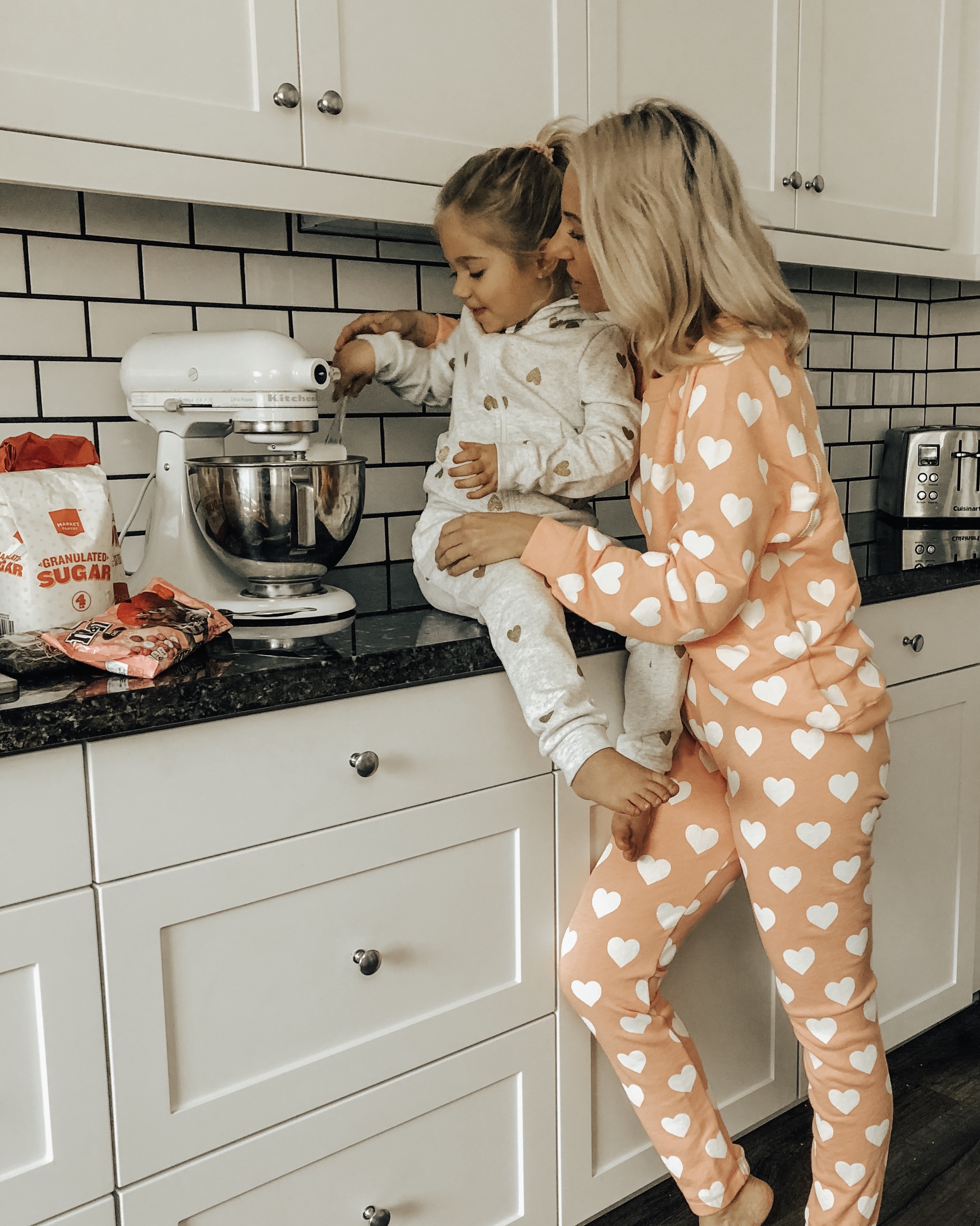 COZY & CASUAL VALENTINES AT HOME- Jaclyn De Leon Style + mommy and me making cookies + valentines inspired outfits + heart matching sets + pink + mini me + mom style + matching pajamas + at home making cookies + in the kitchen + matching outfits + mom life + kid style + nordstrom rack + h&m style