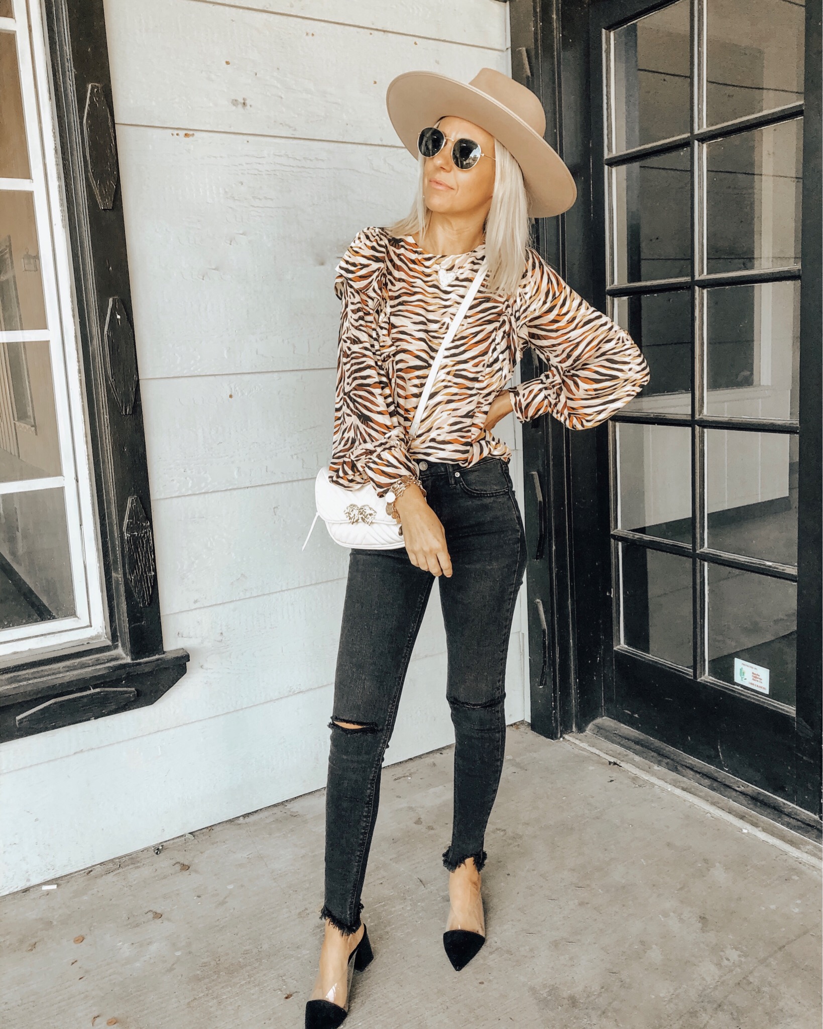 OCTOBER TOP 10- Jaclyn De Leon Style + Sharing the best selling items from the month of October which include a leopard sweater, huggie hoop earrings, graphic tees + sweatshirts, faux fur slippers, striped sweaters, western booties and denim