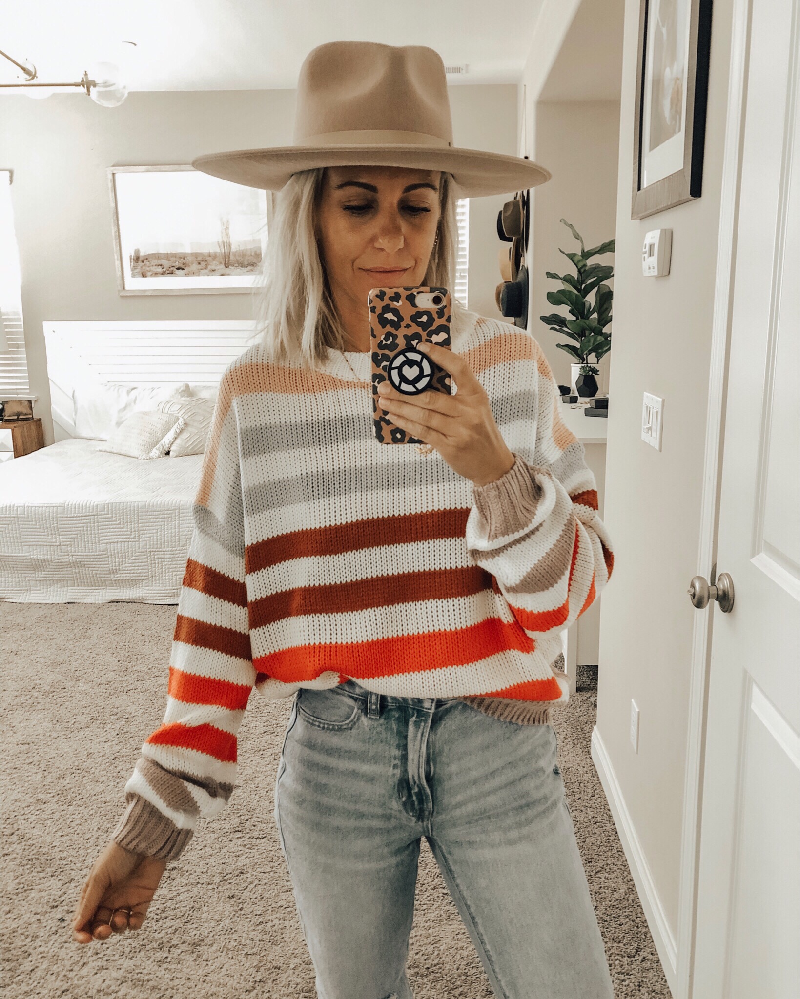 OCTOBER TOP 10- Jaclyn De Leon Style + Sharing the best selling items from the month of October which include a leopard sweater, huggie hoop earrings, graphic tees + sweatshirts, faux fur slippers, striped sweaters, western booties and denim