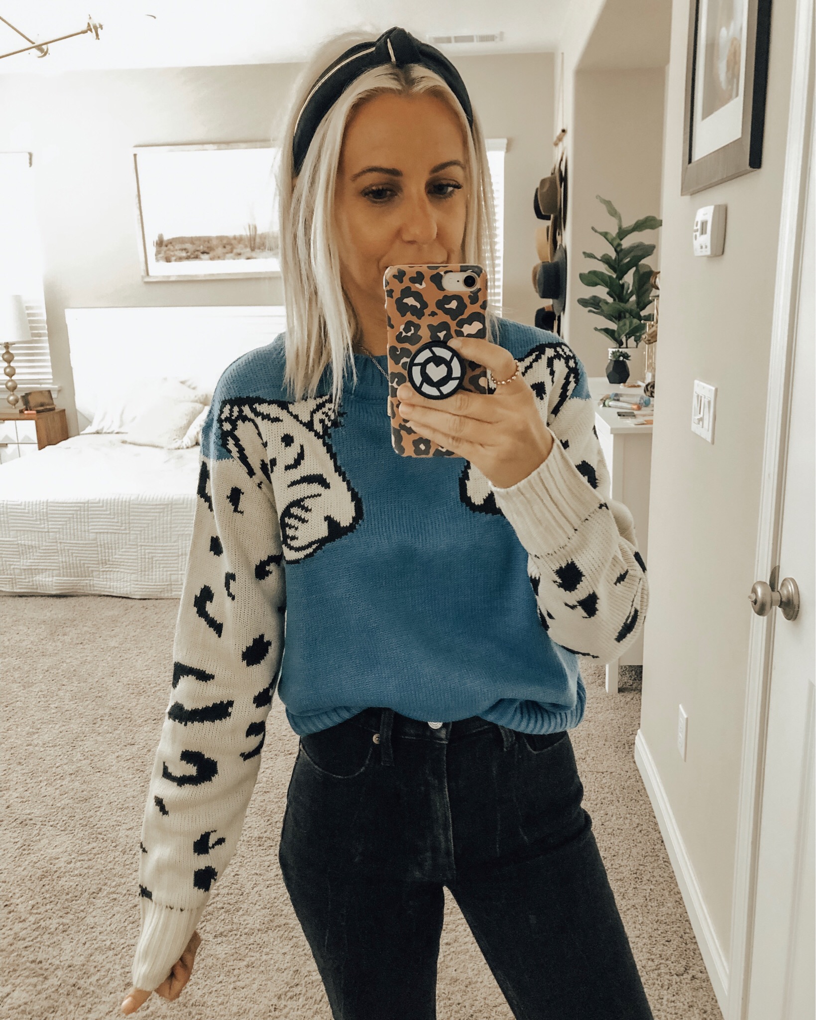 OCTOBER TOP 10- Jaclyn De Leon Style + Sharing the best selling items from the month of October which include a leopard sweater, huggie hoop earrings, graphic tees + sweatshirts, faux fur slippers, striped sweaters, western booties and denim