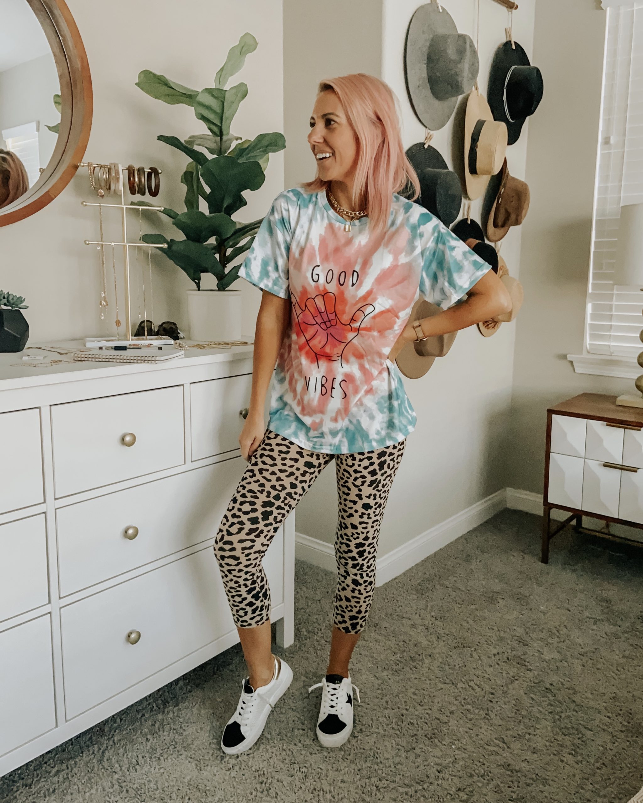 Two Women In Matching Leopard Print Outfits Create An Optical