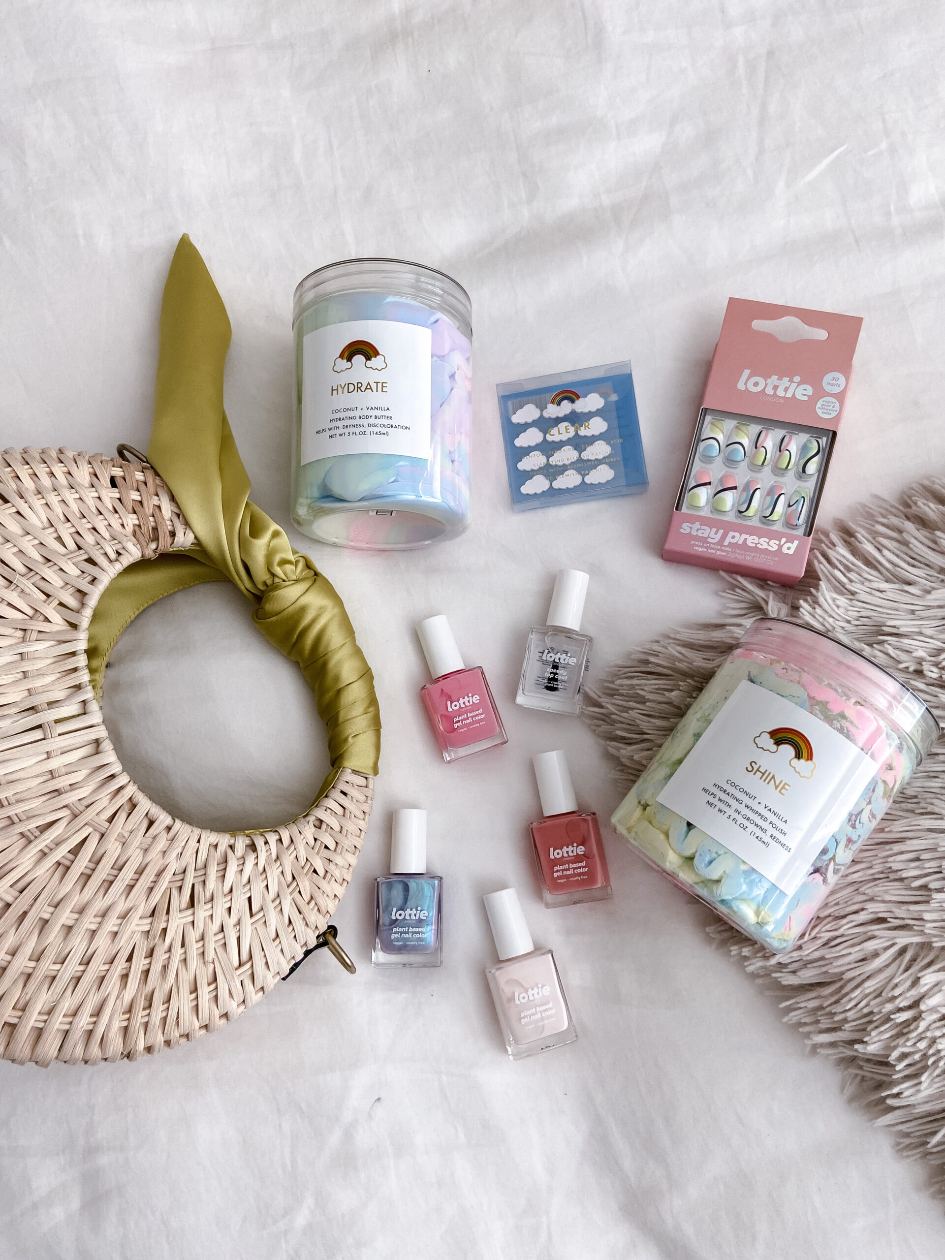 NEW WALMART BEAUTY FINDS-Jaclyn De Leon. Colorful brands discovered at Walmart. Lottie London has fun nail polish and press on nails. Rainbow beauty has a variety of face and body products that are colorful and clean. Perfect for summer.